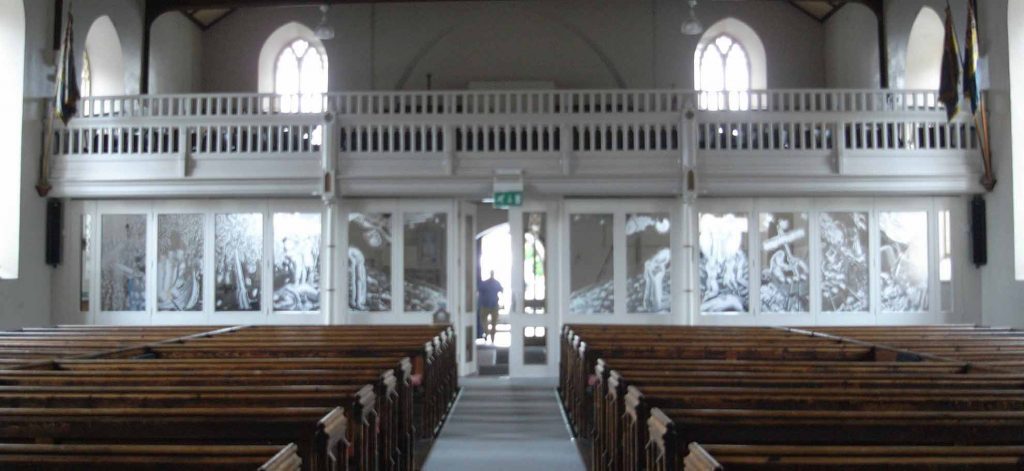 Church interior showing entire St Alphege glass window etching